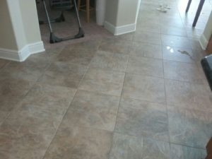 You can see the tile stain going away as we continue working in Sacramento very light grout lines with spill stain being worked on