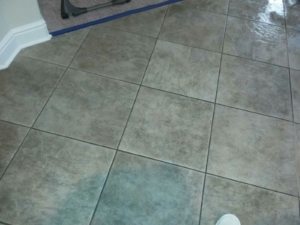 very dark grout lines with a spill stain tile and grout staining